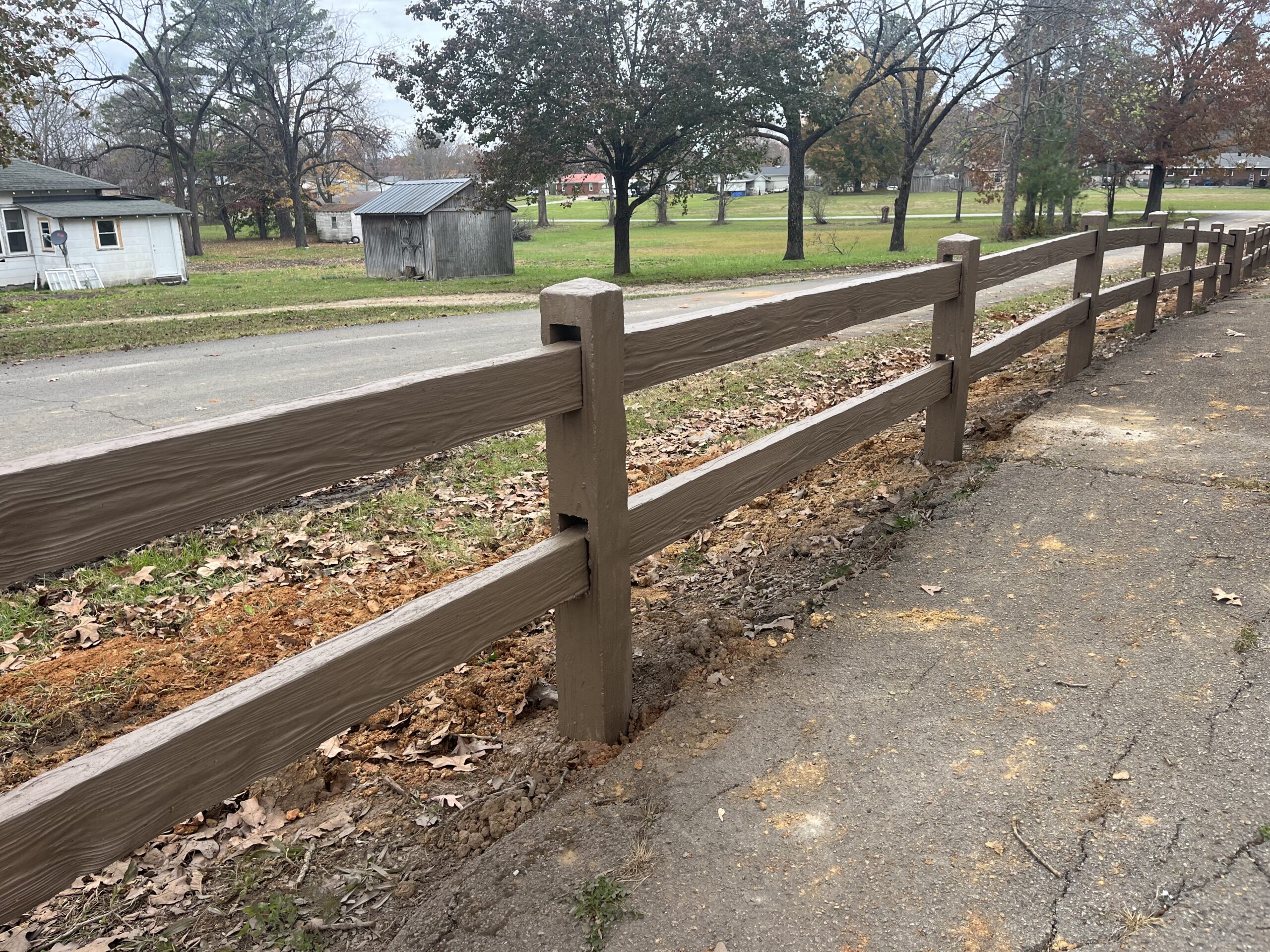 IMG_5964 Tan Concrete Fence next to road and driveway